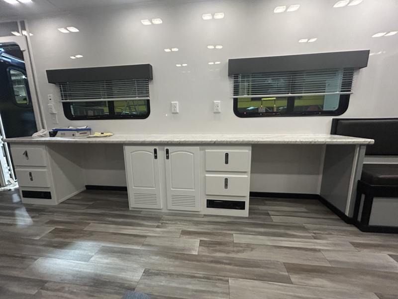 built-in desks and whiteboard wall in the mobile office trailer